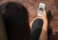 African American woman is listening to music