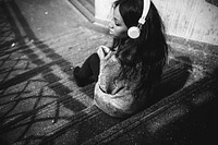African American woman is listening to music