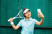 Asian Woman Using Digital Smart Phone Selfie Concept