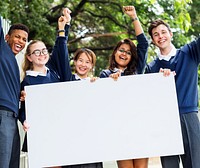 Students holding a white board