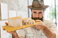 Architect holding a house model