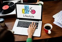 Woman Using Laptop Wprking with Bike Icon on the Screen