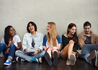 Group of teenagers sitting on the floor