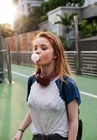 Girl Blowing Bubble Gum Cheerful Lifestyle Concept