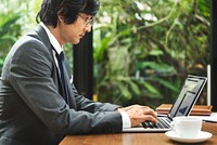 Japanese businessman working on  laptop