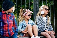 Fashionista kids sitting at a park