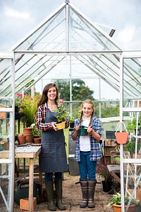 Young women in the glass greenhouse