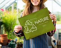 Young woman showing nature poster