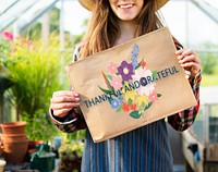 Girl holding a floral poster