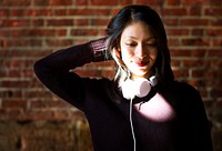 Cheerful woman listening to music