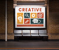 Different creative icons posted in a subway station