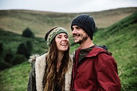 Closeup of caucasian couple with hills background