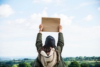 Woman holding paper board