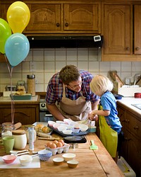 Kid baking with dad
