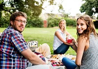 Happy family picnic in the park