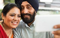Loving senior Indian couple taking a selfie