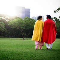 Loving senior Indian couple playing superheroes