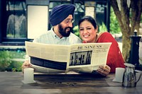 Indian Couple Reading Newspaper Concept