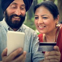Indian Couple Using Device Concept