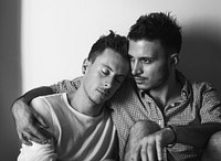 Sweet gay male couple close together