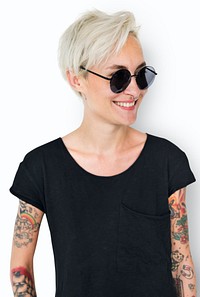 A blonde short-haired woman with tattoos