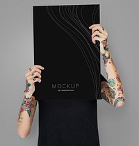Tattooed woman showing blank mockup poster