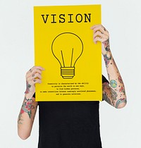 Tattoed person showing a vision poster