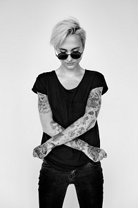 Tattooed woman in black tee grayscale