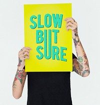 Tattooed person showing Slow but sure poster