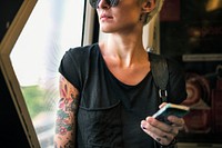 Tattooed woman on a train