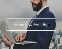 Dream big aim high overlay on businessman in the city