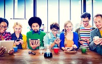 Diverse people using digital devices