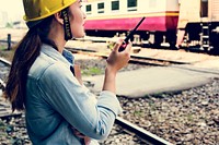 Female inspector at railroad tracks