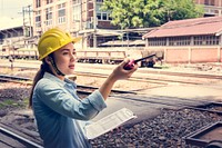 Female inspector at railroad tracks