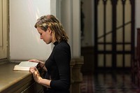 Woman praying in the church