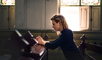 Woman praying in the church