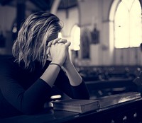 Woman praying in the church