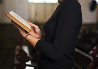 Woman praying in the church