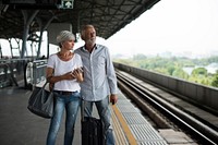 Senior couple traveling train station