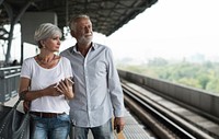 Senior couple traveling train station
