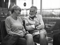 Senior couple waiting for boarding inside airport