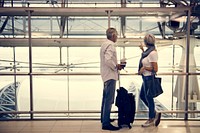 Senior couple traveling airport scene