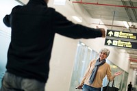 Old guy picking up his woman at the airport