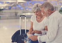 Senior couple traveling airport scene