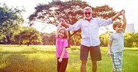 Grandfather Enjoy Grandchildren Outdoors Together