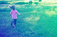 Little Girl Running in Grass Field Park Outdoors