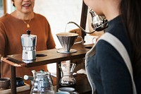 Woman preparing beverage for a customer