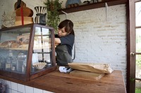 Woman organizing some stuff in her shop