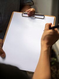 Writing on a blan clipboard paper