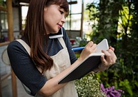 Florist taking an order from a phone